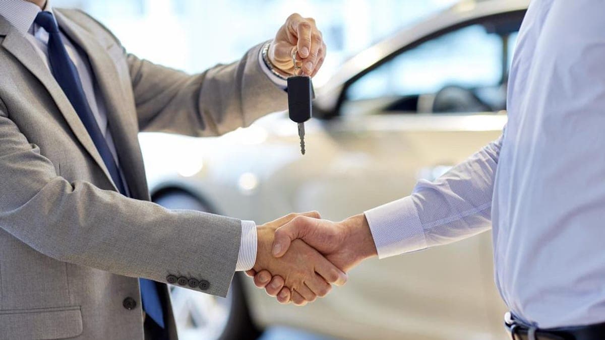 Organised service history documents and car keys ready for sale