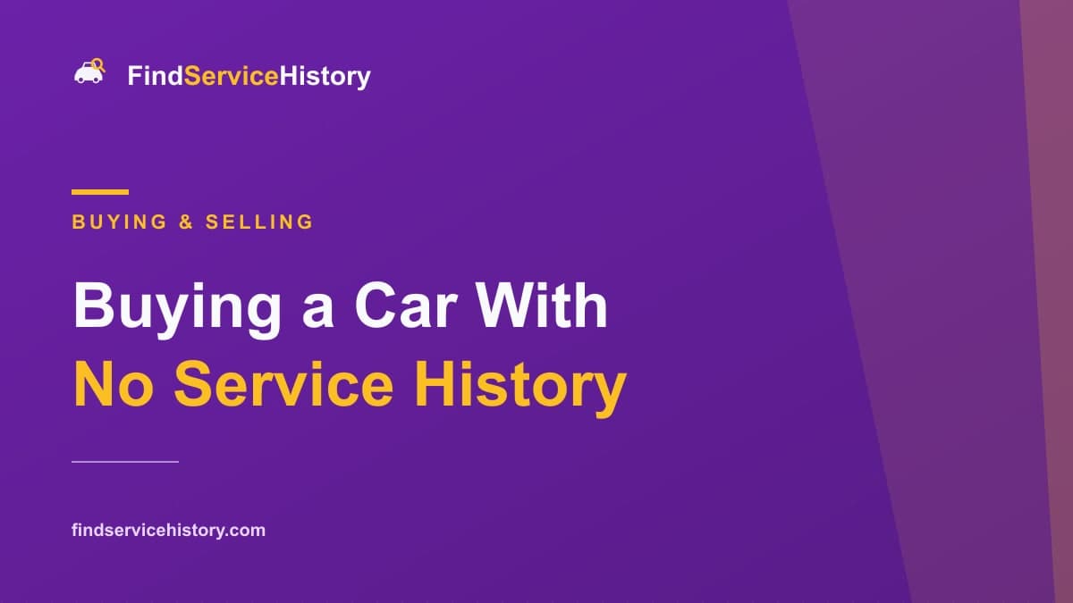 A used car for sale on a driveway with an empty service book