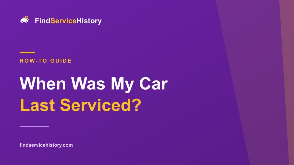 A car dashboard showing a service due warning next to an open service book